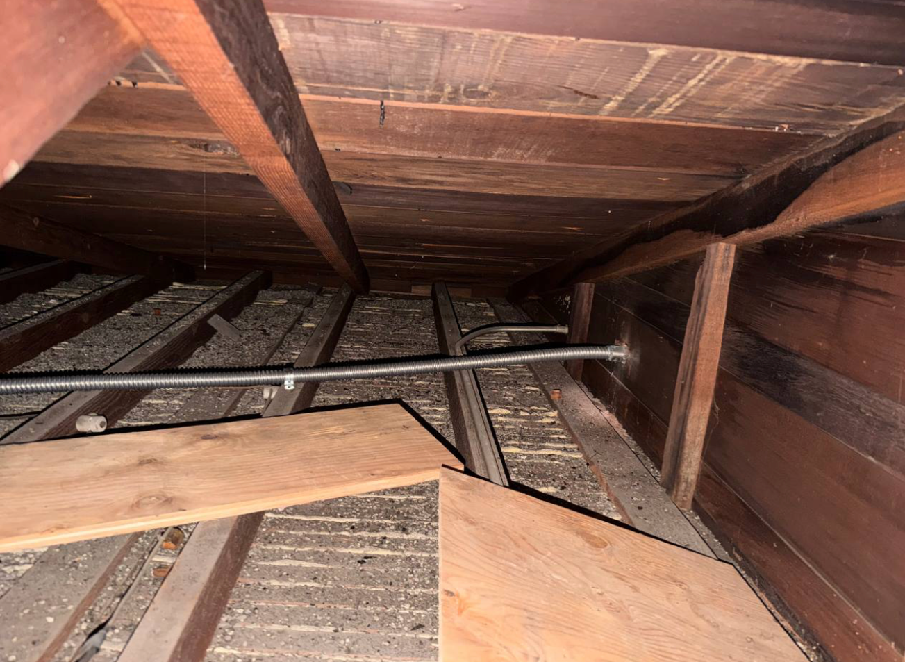Conduit run through attic framing, keeping all wiring out of sight from the exterior.