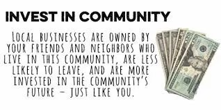 A picture of some money and the words " invest in community."