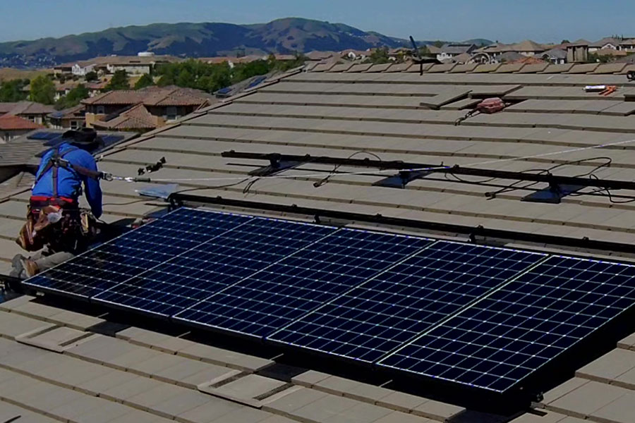 A solar panel on the roof of a house.