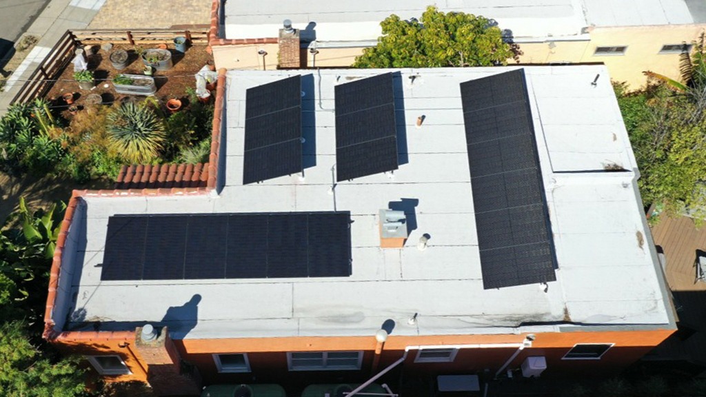 A building with solar panels on the roof.